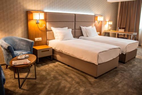 Hotel Golden Tulip Varna客房内的一张或多张床位