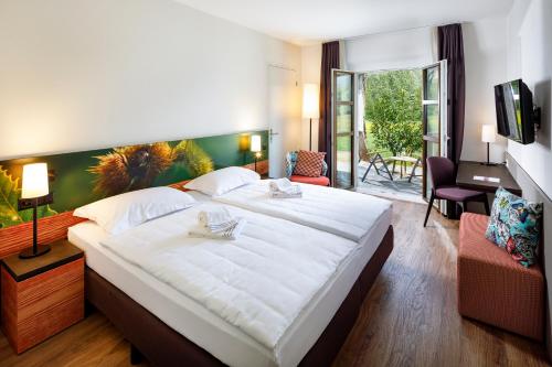 Hotel Bellinzona Sud Swiss Quality客房内的一张或多张床位