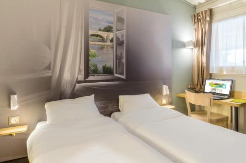 B&B HOTEL Montauban客房内的一张或多张床位