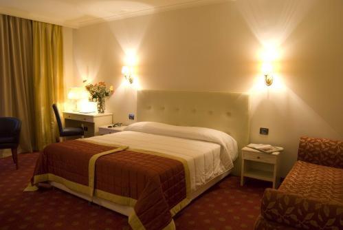 萨乌托皇宫酒店客房内的一张或多张床位