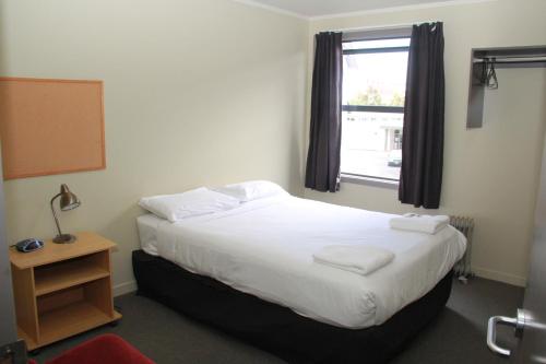 尼考公寓酒店客房内的一张或多张床位