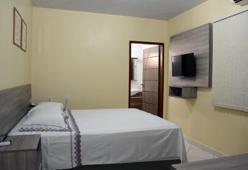 Hotel Goiânia客房内的一张或多张床位