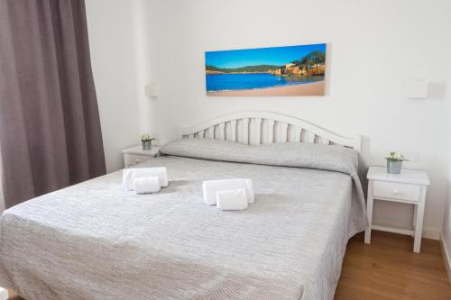 Naranjos Resort Menorca客房内的一张或多张床位