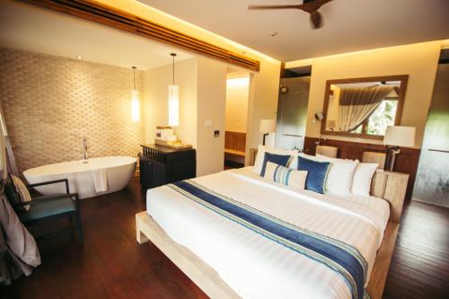 阿南塔雅Spa帕西库达度假酒店客房内的一张或多张床位
