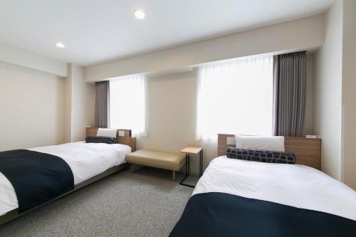 名古屋站贾斯特尊贵酒店客房内的一张或多张床位
