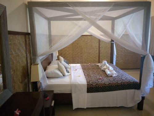 素馨兰花海滩酒店客房内的一张或多张床位