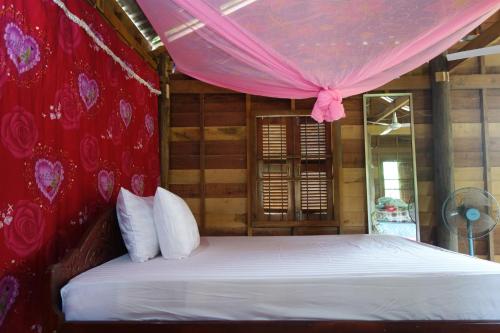 Authentic Cambodian Angkor Cottage客房内的一张或多张床位