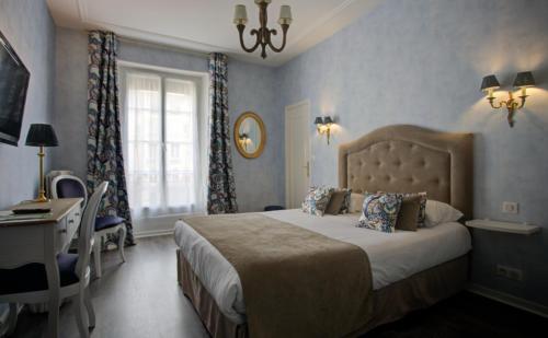 杜梅尔酒店客房内的一张或多张床位