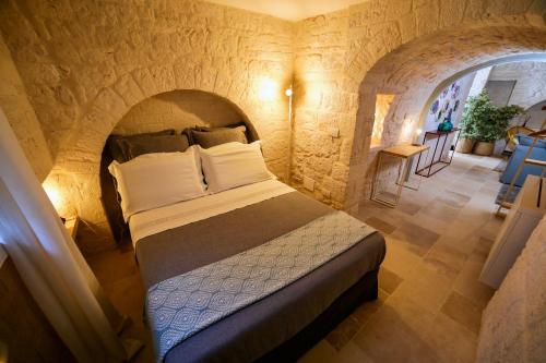 Hermanas Relais - trulli luxury客房内的一张或多张床位