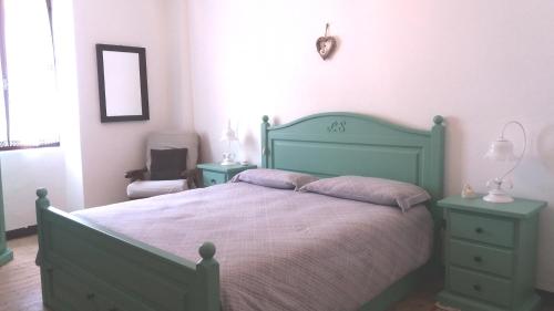 Appartamento Novecento客房内的一张或多张床位