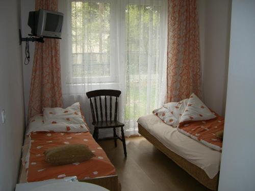Pokoje Delfin Hostel客房内的一张或多张床位