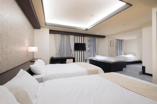 EN HOTEL Fujisawa客房内的一张或多张床位