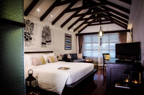 纳尼兰德浪漫精品度假酒店 客房内的一张或多张床位