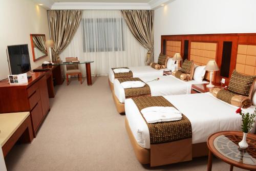 Marigold Hotel客房内的一张或多张床位