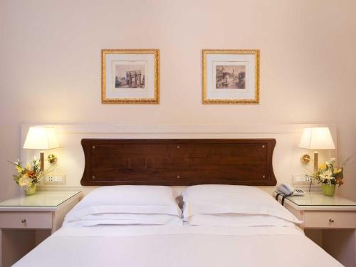 多米兹伊诺奥酒店客房内的一张或多张床位