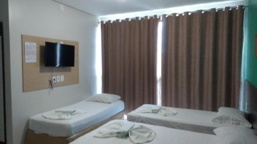 Entre Rios Hotel客房内的一张或多张床位