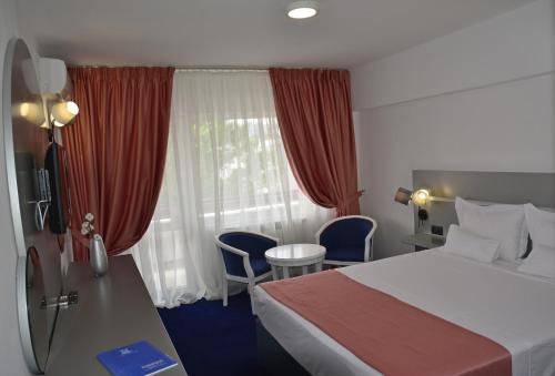 尤洛普里斯酒店客房内的一张或多张床位