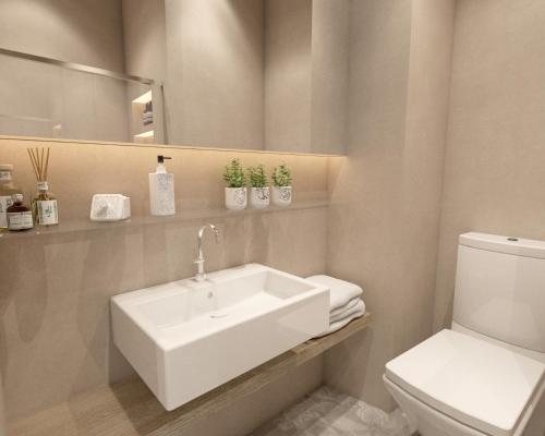 雅典Great Living Koukaki的浴室配有白色水槽和卫生间。