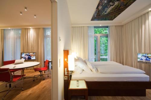 马斯曼豪华酒店客房内的一张或多张床位