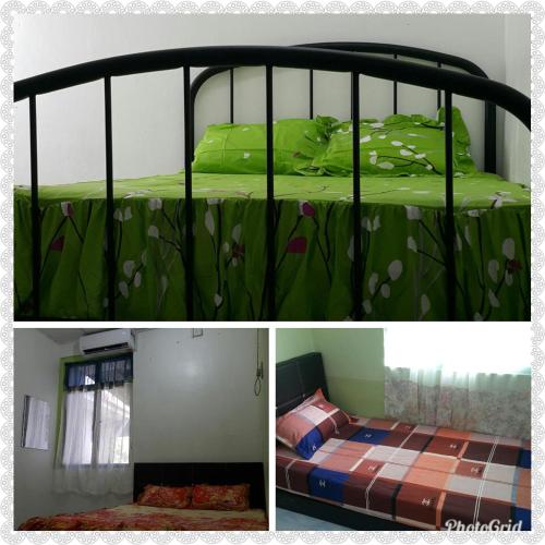 丹那美拉DIDIE HOMESTAY 1的一间卧室配有一张带绿色棉被的床