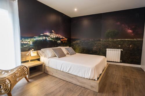 莫雷拉Sant Joan的一间卧室配有一张壁画床