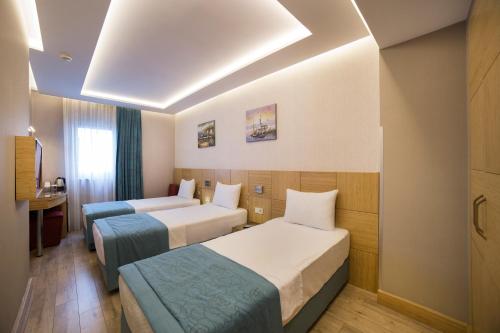 Meretto Hotel LALELİ客房内的一张或多张床位