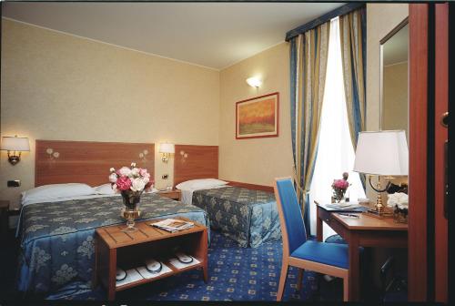 迪耶奇酒店客房内的一张或多张床位