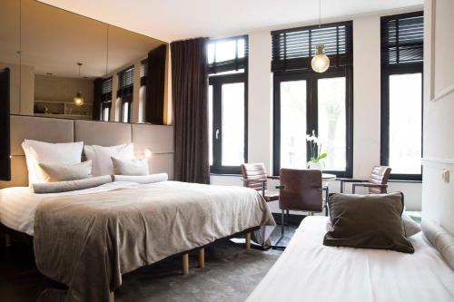 阿姆斯特尔豪斯酒店客房内的一张或多张床位