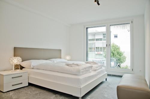 Apartment JungfrauCenter Brienzersee - GriwaRent AG客房内的一张或多张床位