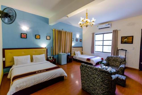 A25 Hotel - Hoàng Quốc Việt客房内的一张或多张床位