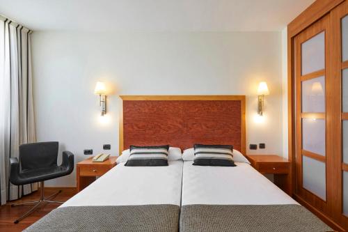 爱科赛德利西亚广场酒店客房内的一张或多张床位