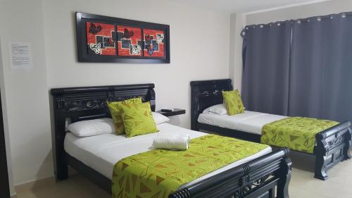 加勒比海岛皮索2号酒店客房内的一张或多张床位