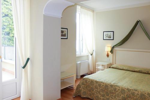 拉蜜拉贝乐别墅酒店客房内的一张或多张床位
