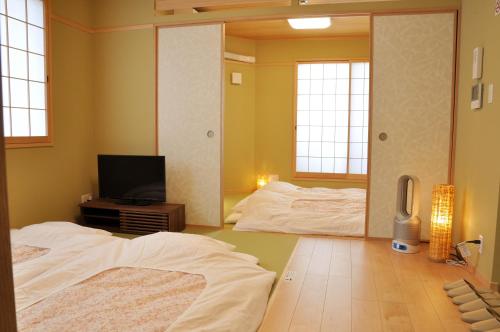 harper house传统日式旅馆客房内的一张或多张床位