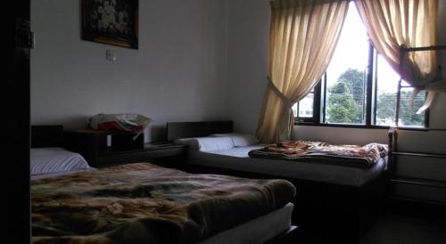 Nuwara Eliya Homestay客房内的一张或多张床位