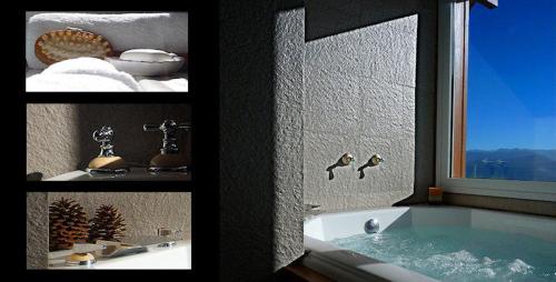 圣卡洛斯-德巴里洛切El Nautico Lodge Bariloche的带浴缸的浴室和窗户