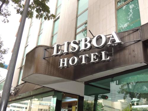 墨西哥城Lisboa Hotel的大楼顶部酒店标志