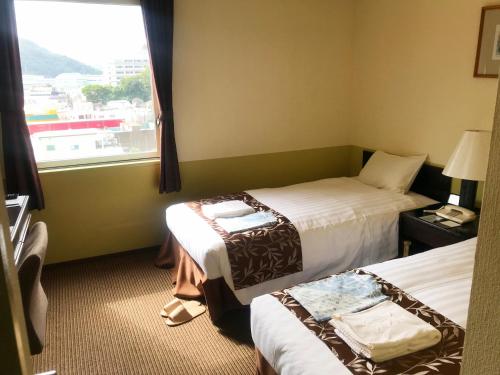 Hotel Crown Hills Kamaishi客房内的一张或多张床位