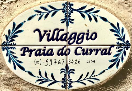 伊利亚贝拉Propriedade a 80 metros da praia do Curral的一种表明维利亚科里亚教区(viliaccoaria do civitan)的标志