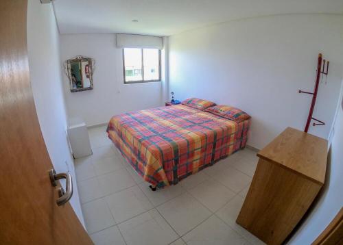 Carneiros Beach Particular Flat客房内的一张或多张床位