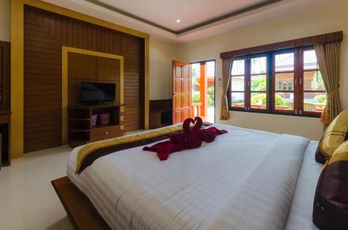 Sleep In Lanta Resort客房内的一张或多张床位