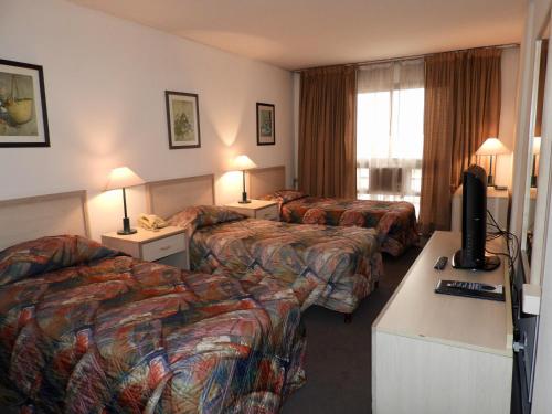 特雷斯克鲁塞斯酒店客房内的一张或多张床位