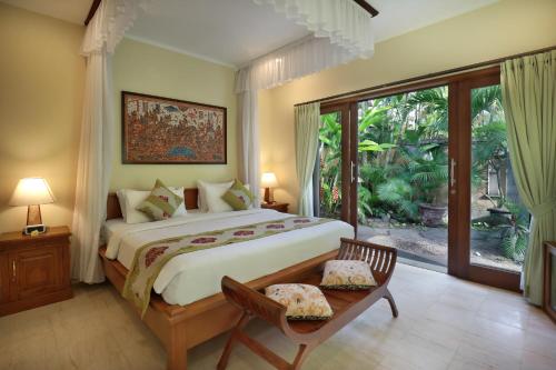 布阿巴厘岛别墅酒店客房内的一张或多张床位