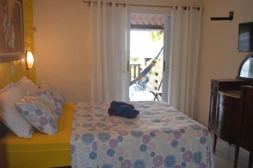 Pousada Kamaka Praia客房内的一张或多张床位
