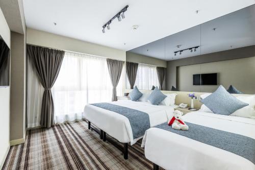 铜锣湾颐庭酒店客房内的一张或多张床位
