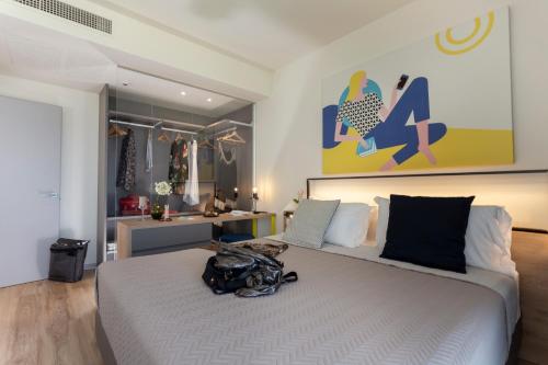 App Sea View客房内的一张或多张床位