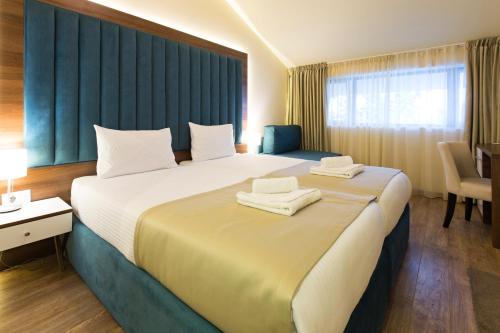 格尼玛库赛酒店客房内的一张或多张床位