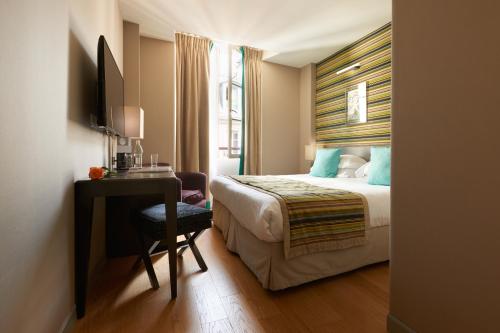 
乐马图林酒店及水疗中心 客房内的一张或多张床位

