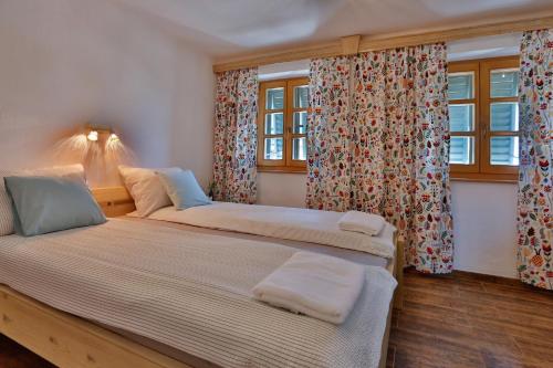 Csendes Dűlő Szőlőbirtok Guesthouse Badacsonyörs客房内的一张或多张床位