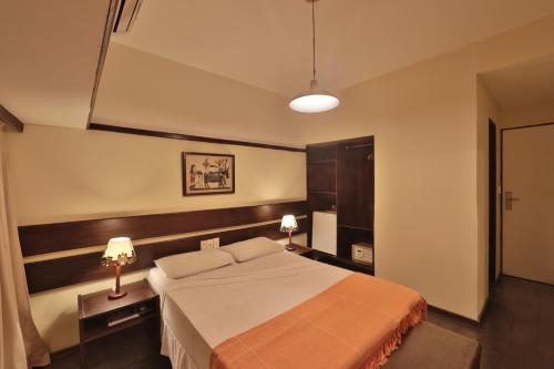 波萨达圣弗朗西斯科酒店客房内的一张或多张床位